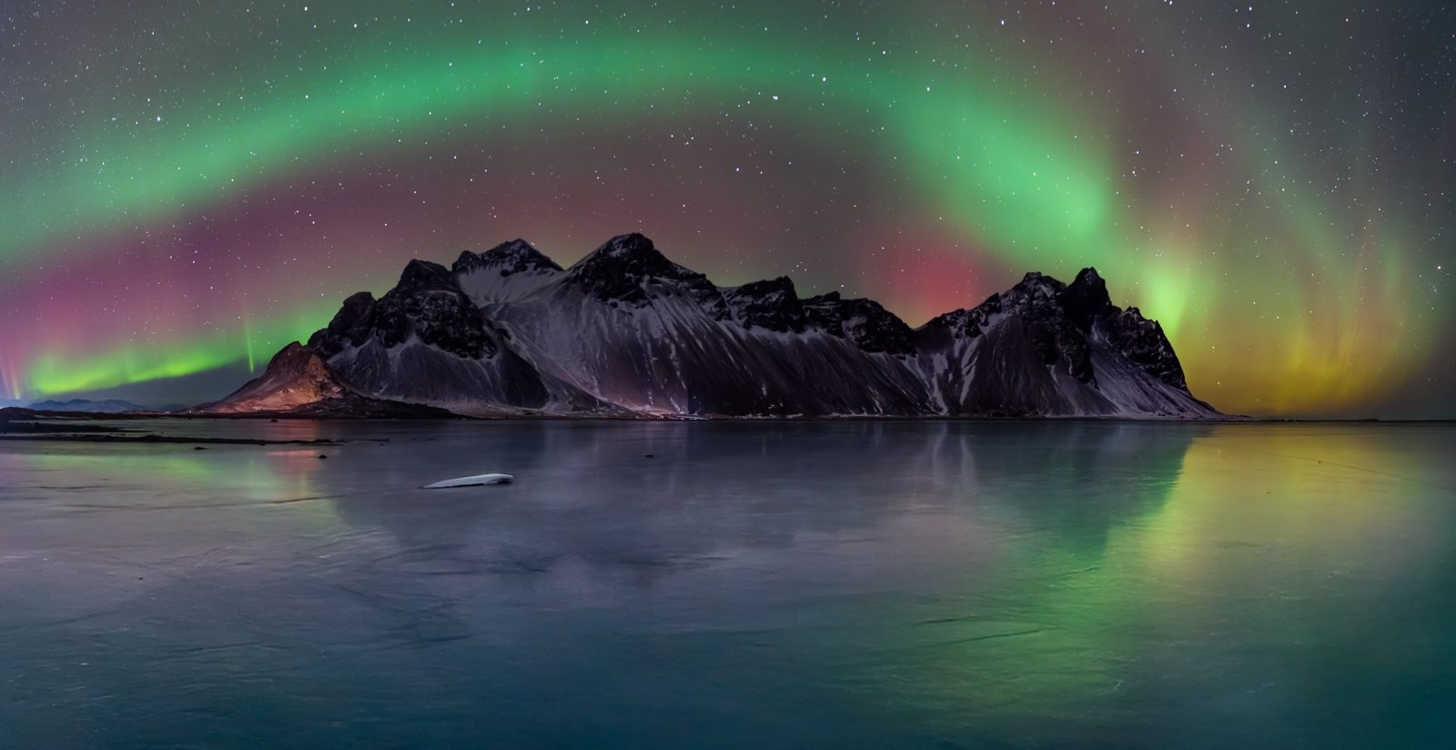 Frozen Aurora Reflections at Vestrahorn by Louise Mckenna